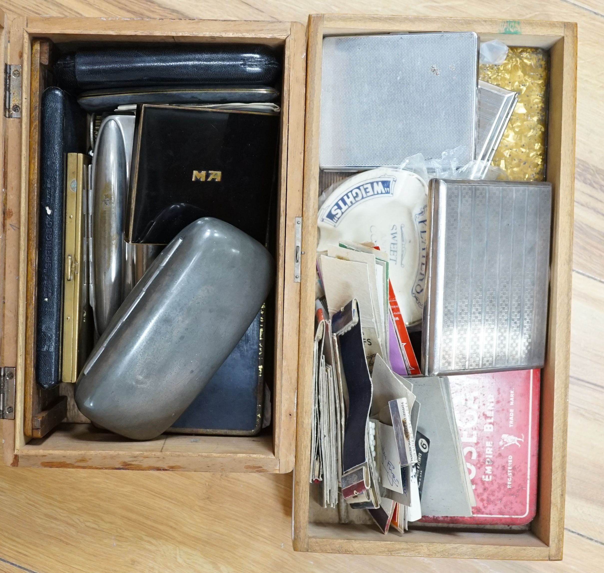 A Players Weights cigarette advertising ashtray, a collection of advertising match books, various tins and cigarette boxes, cigar cases etc